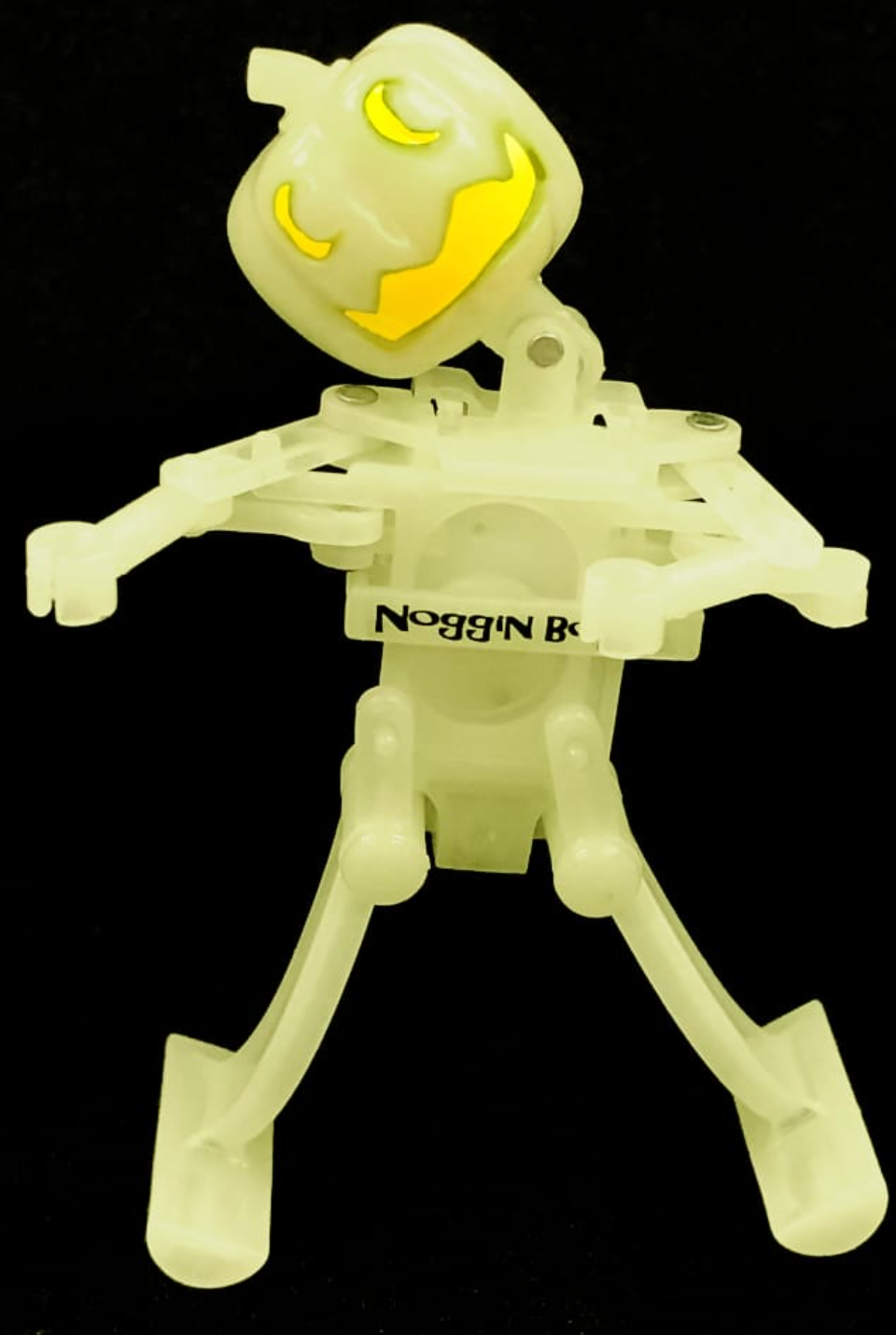 Glow in the dark wind-up dancing Jack-O-Lantern toy with a happy pumpkin face and movable arms and legs