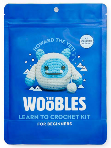 Blue packaging of The Woobles crochet kit featuring Howard the Yeti character made of chunky yarn with crochet tools included