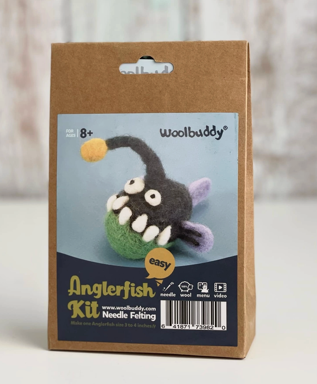 Woolbuddy beginner needle felting kit with materials to create a small colorful anglerfish craft figure