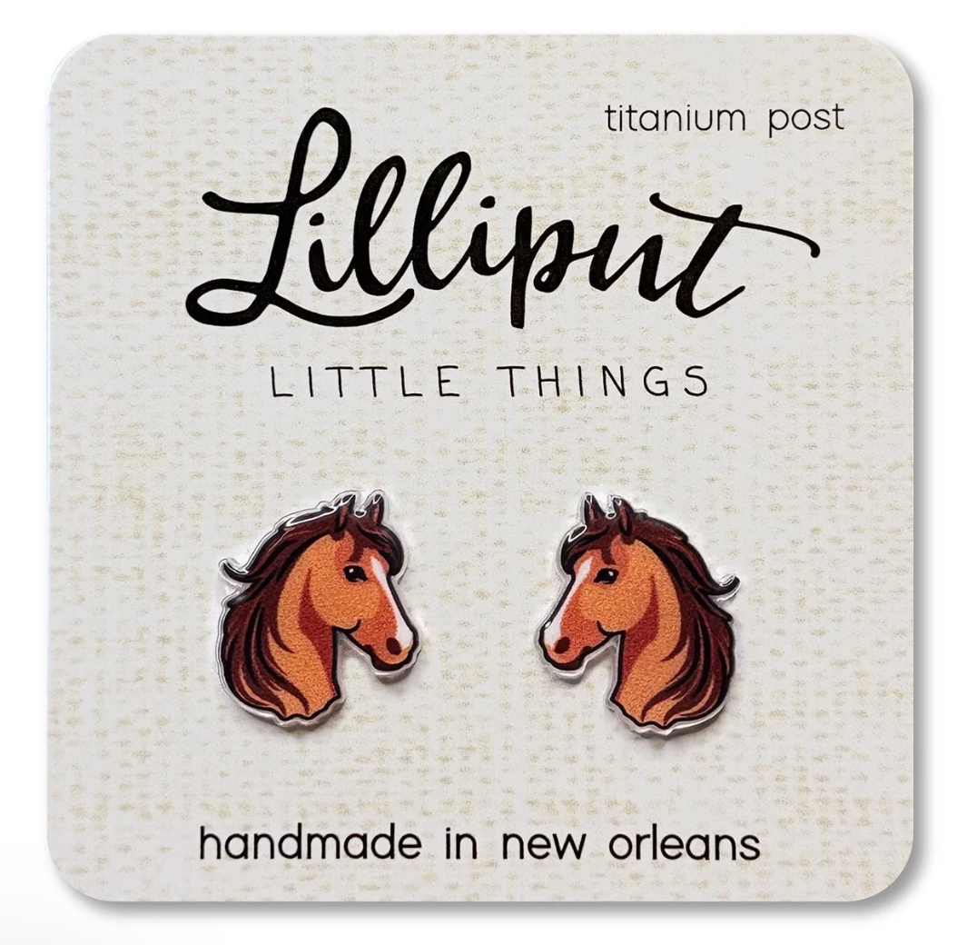 Cute horse head stud earrings with titanium posts on a branded card, designed for sensitive ears and everyday wear