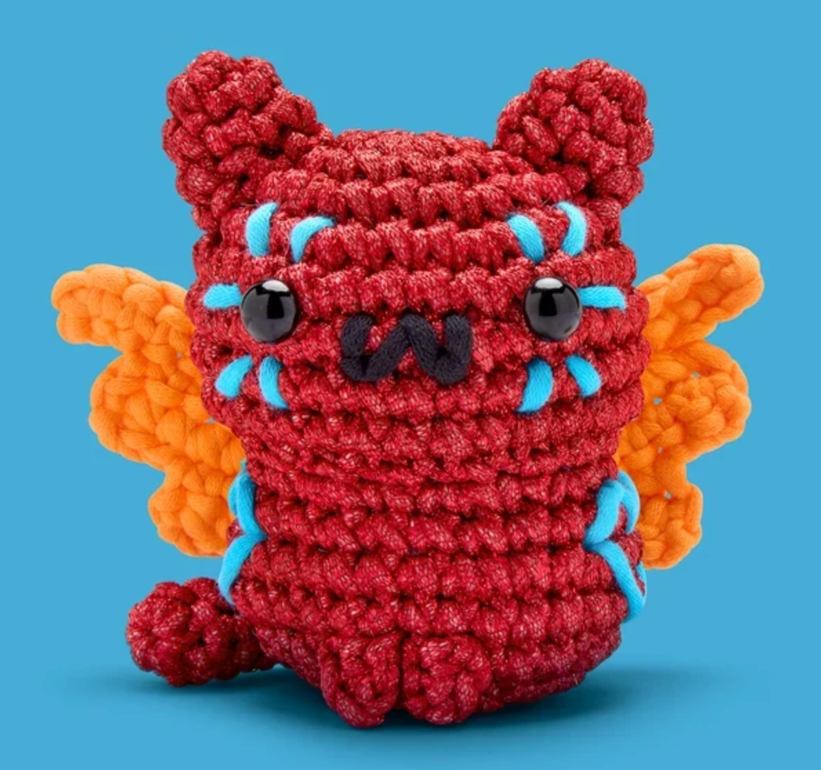 The Woobles Crochet Kit | Maya the Alebrije Cat red crocheted cat with orange wings