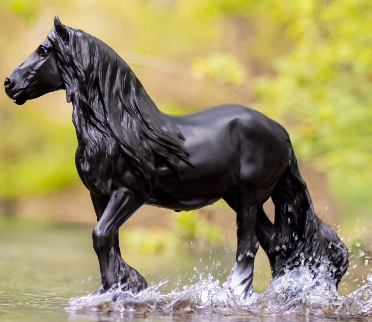 GG Kiss Me Kate black horse toy splashing through shallow water