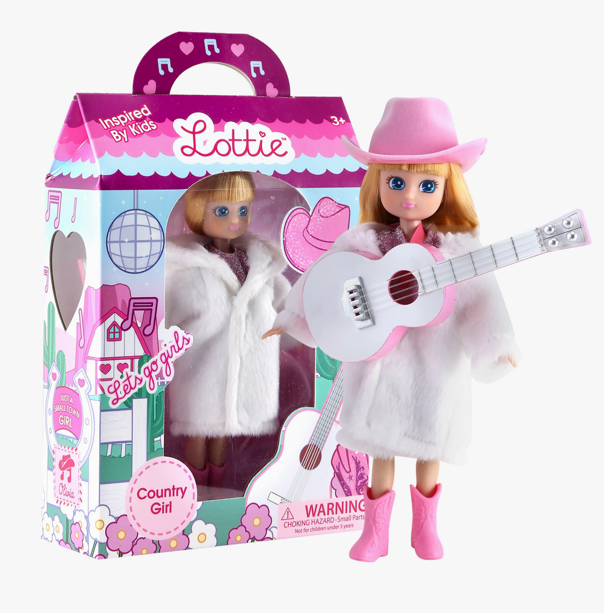 Lottie Country Girl doll in pink cowboy hat and white coat with guitar and boxed doll accessory