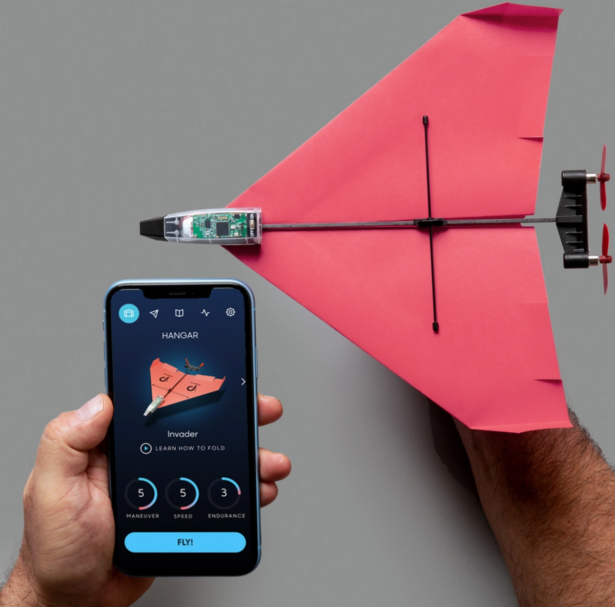 Powerup 4.0 RC Smartphone Paper Airplane Engine with smartphone and red paper airplane