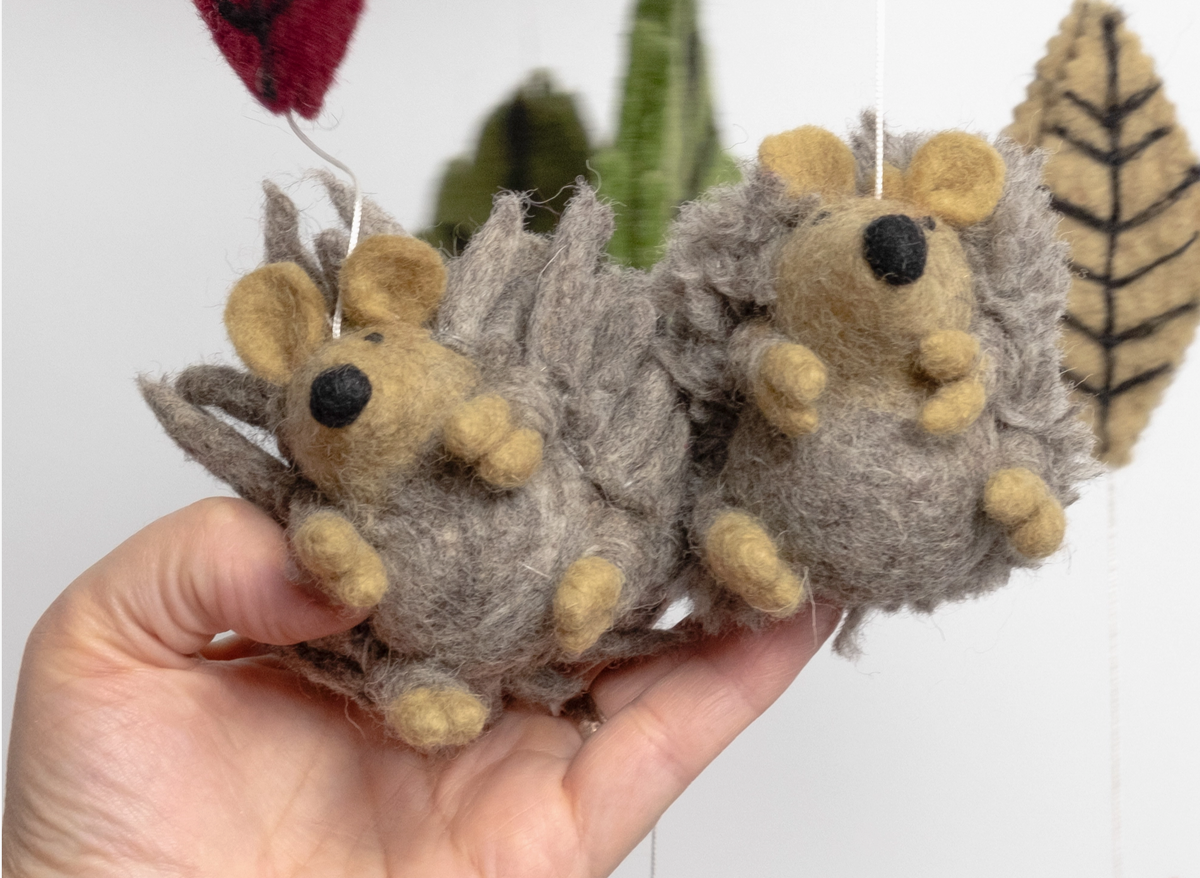 Felt Mobile | Hedgehog with two soft gray felt hedgehog ornaments and woodland leaves