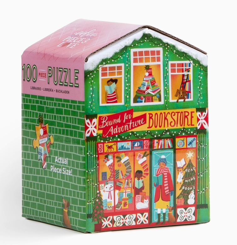 100pc Christmas Market Puzzle in a festive bookstore-shaped box with colorful holiday market artwork