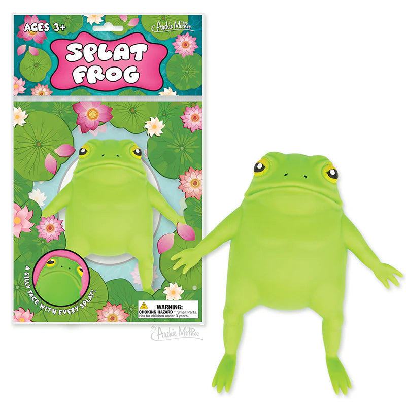 Green squishy frog toy with warty back and outstretched limbs next to colorful packaging with lily pads and flowers