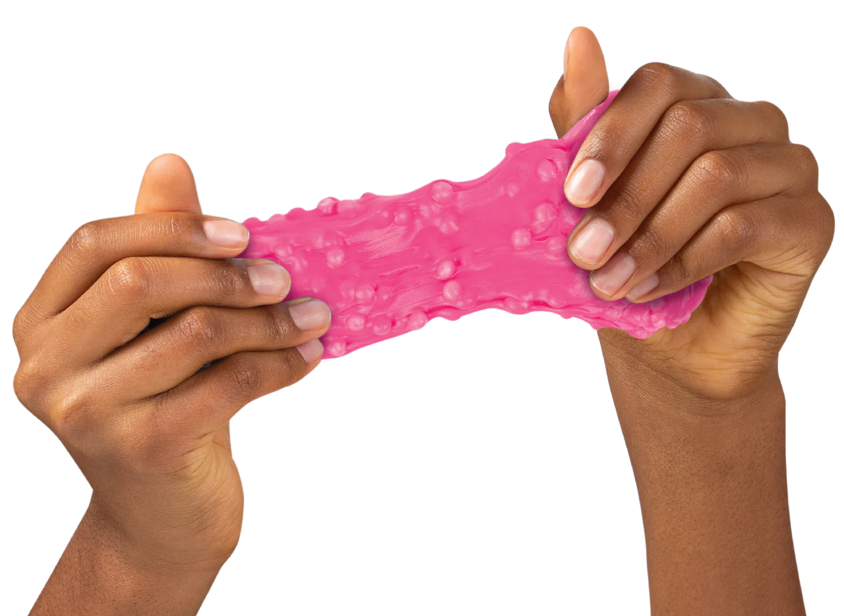 Hands stretching bright pink Sponge Putty Thinking Putty with a bubbly, sponge-like texture for fidget fun and creativity.