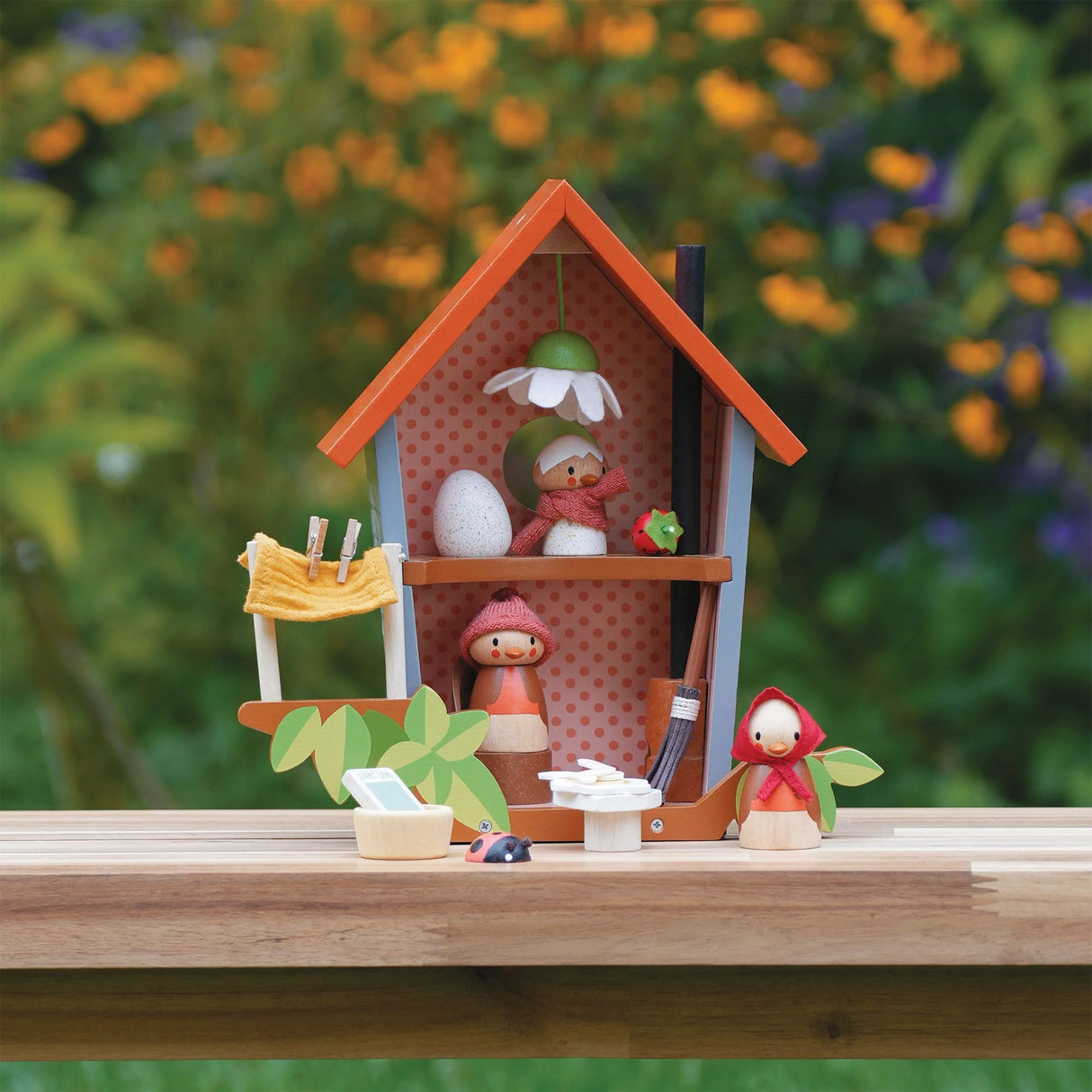 Robin's Nest Box with wooden figures of Robin family, egg, and fold out backdrop for storytelling and play.