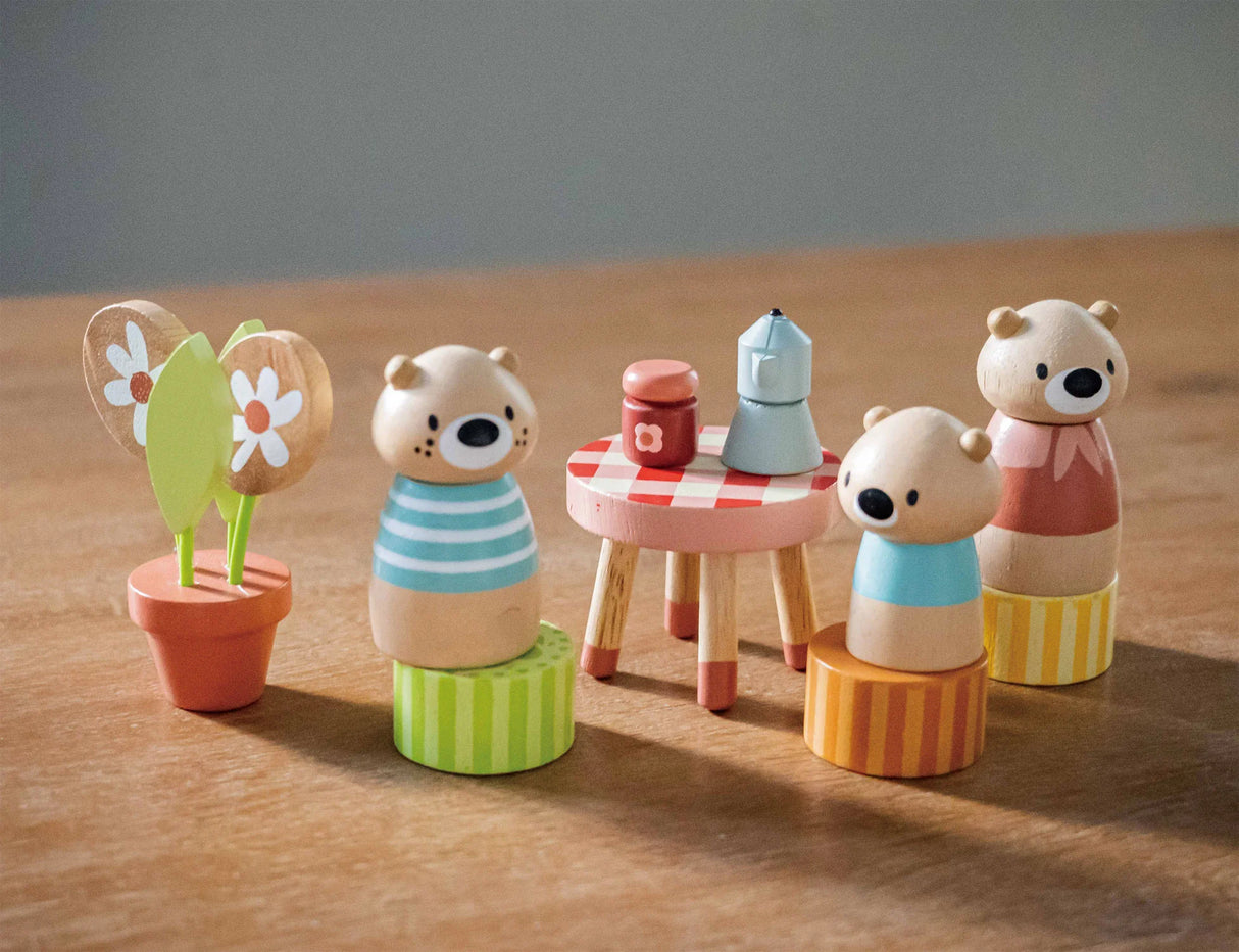 Little Otter Canal Boat with three otter figures, flowerpot, and round table set with coffee pot and jam jar lid.