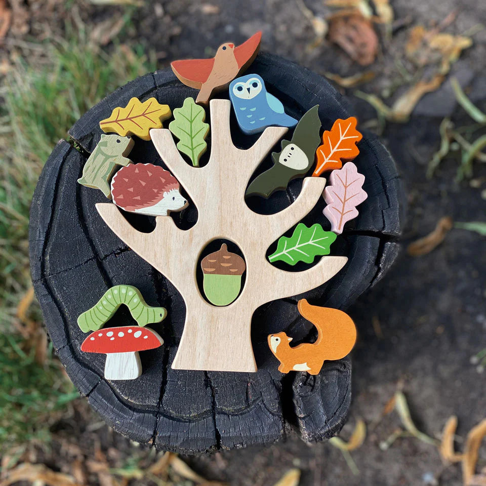 Stacking Forest wooden tree trunk with colorful animals and plants including owl, squirrel, leaves, toadstool, and acorn.