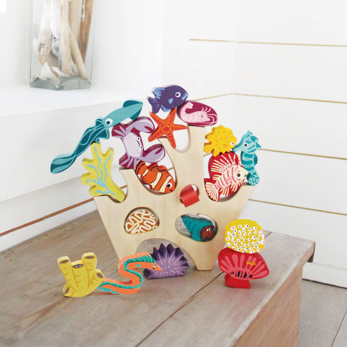 Stacking Coral Reef wooden toy with 18 colorful sea creatures including fish, starfish, seahorse, and coral pieces.
