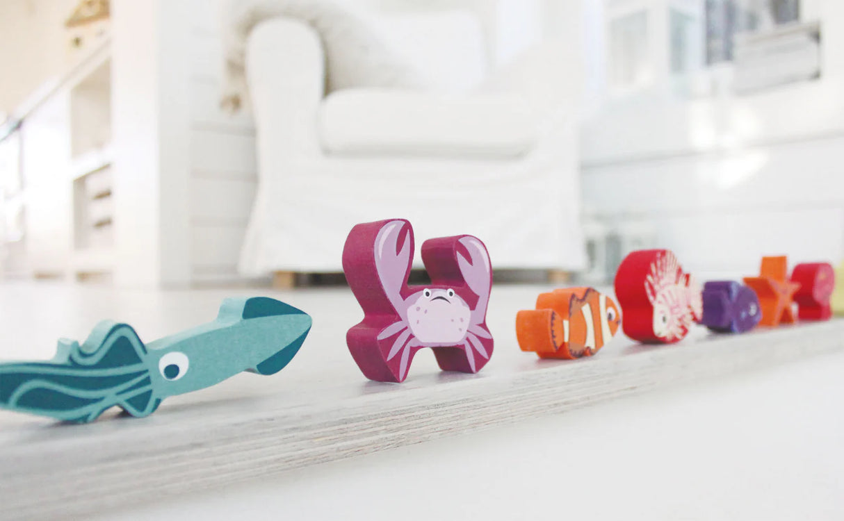 Stacking Coral Reef wooden toy featuring colorful sea creatures like squid, crab, fish, and coral pieces for toddlers.