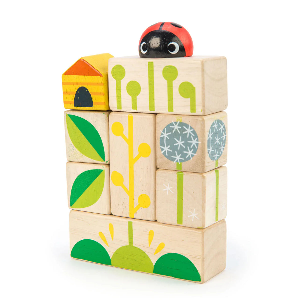 Stacked Garden Blocks with nature-themed illustrations including leaves, flowers, a ladybug, and a small house shape.