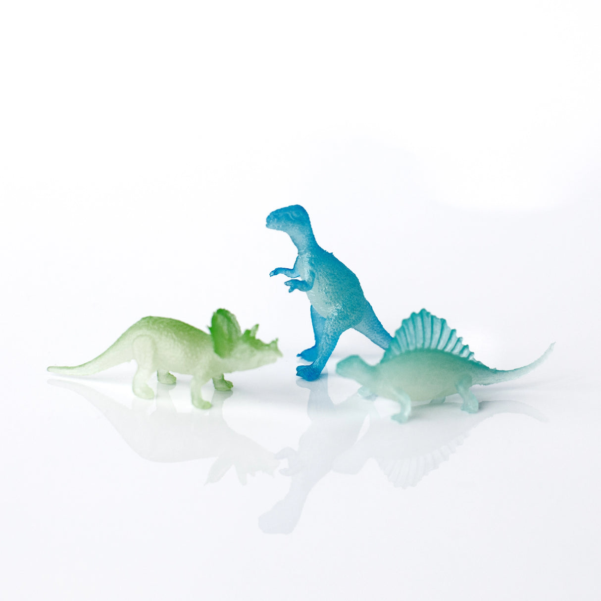 Surprise Dinosaur Bath Bomb reveals colorful dinosaur toys after fizzing in bath water, perfect for a fun bath experience.