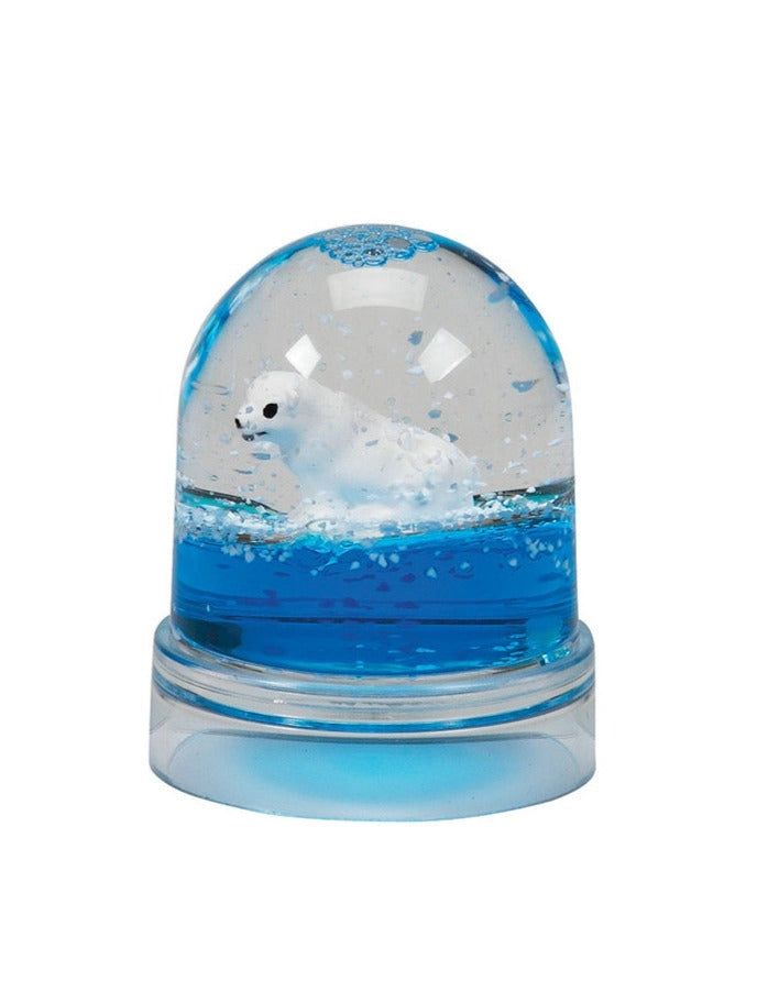 Snow Dome | Polar Bear shows a cute polar bear floating inside a 2.5-inch tall snow globe with blue water.