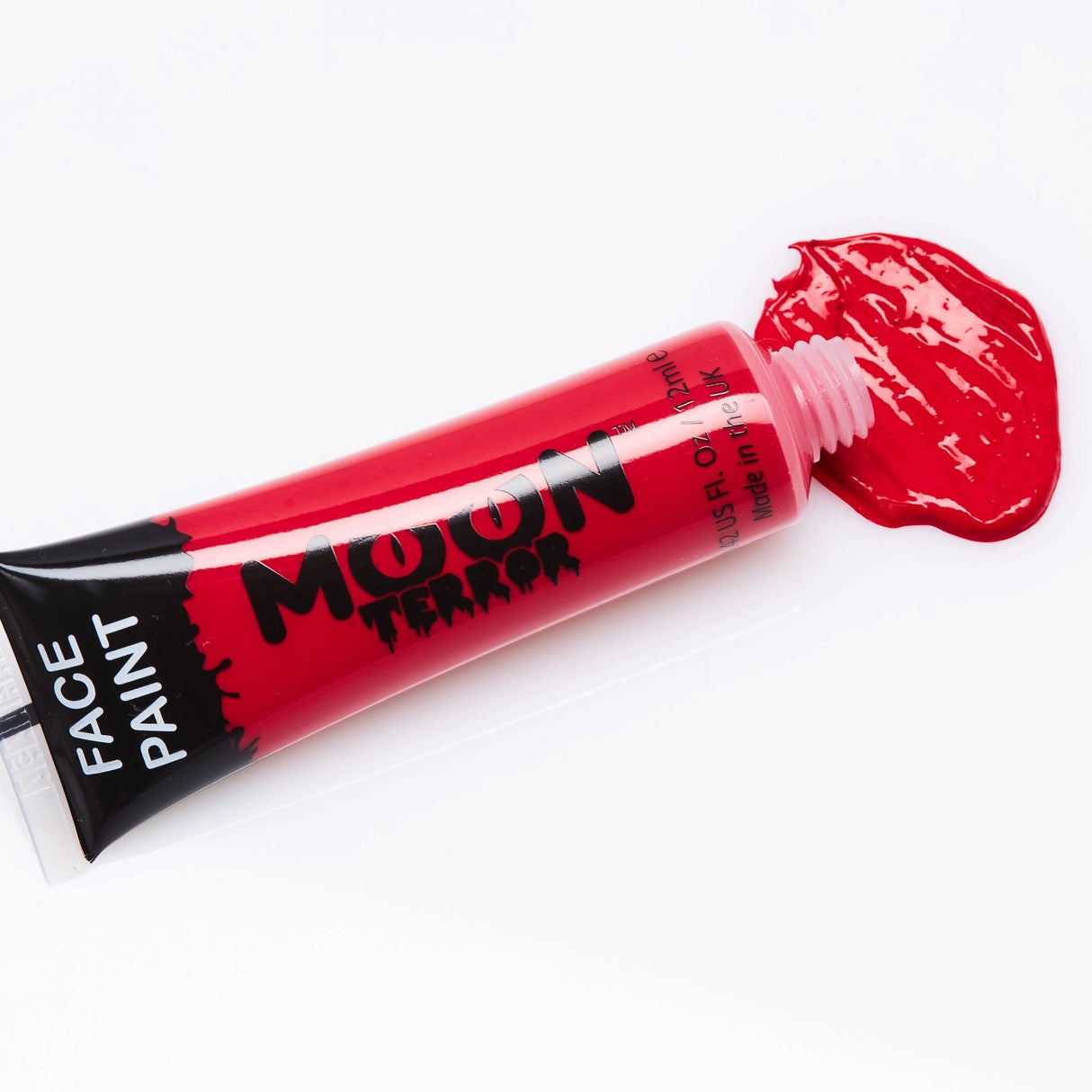 Face & Body Paints | Halloween red water-based face paint tube with spilled vibrant color for spooky designs.