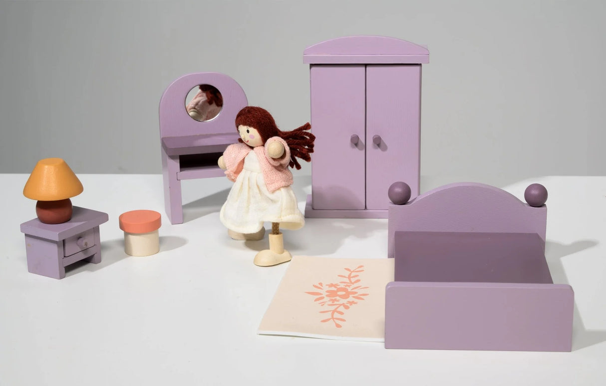 Wooden doll house bedroom set with purple furniture including bed, wardrobe, dressing table, stool, bedside table with lamp, and rug