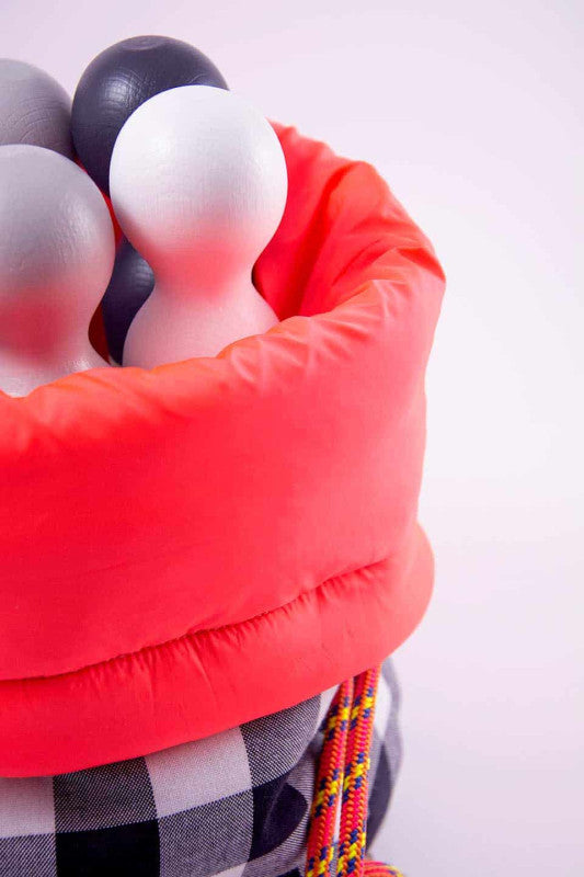 Bowling set with six beech wood pins in red lined waterproof bag for fun hand-eye coordination games.