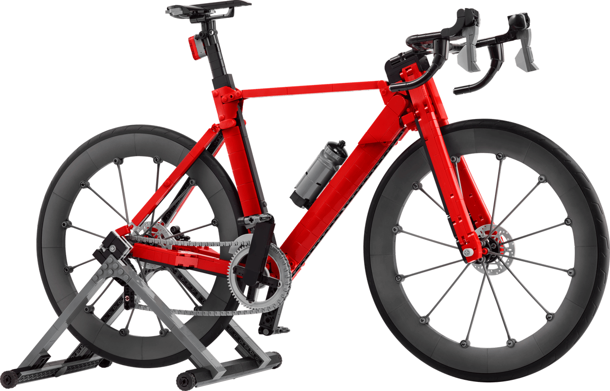Icons Road Bike red electric bicycle with drop handlebars and wide black wheels