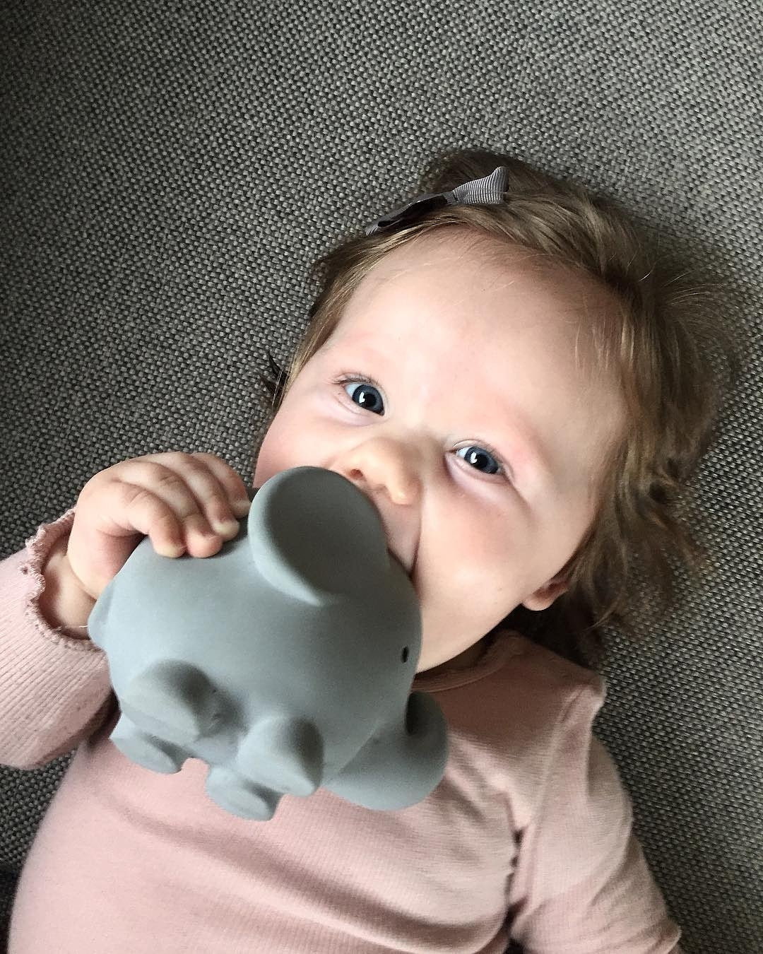 Baby chewing on an Organic Rubber Teether Rattle | Elephant made from safe, non-toxic natural rubber, easy for little hands to hold.
