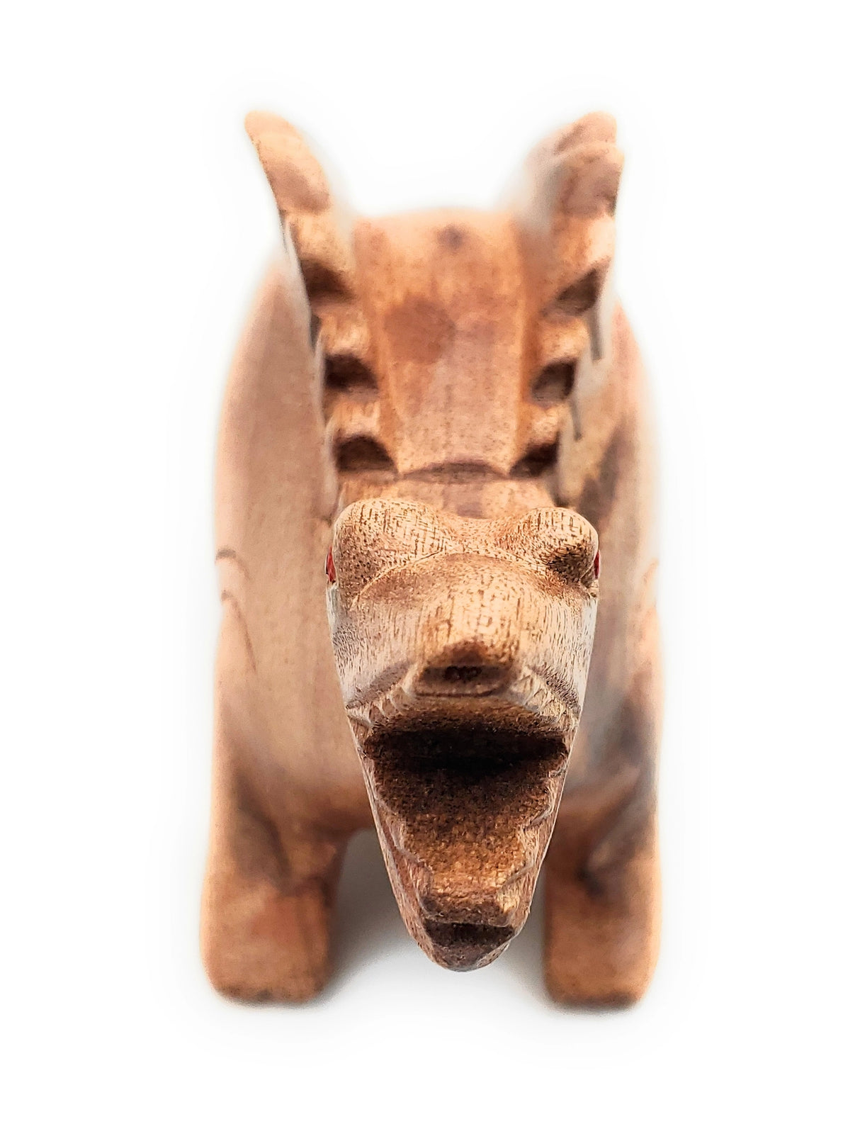 Wooden Dino-Sound Stegosaurus handcrafted wooden dino carving that produces sound when blown through its back air hole.