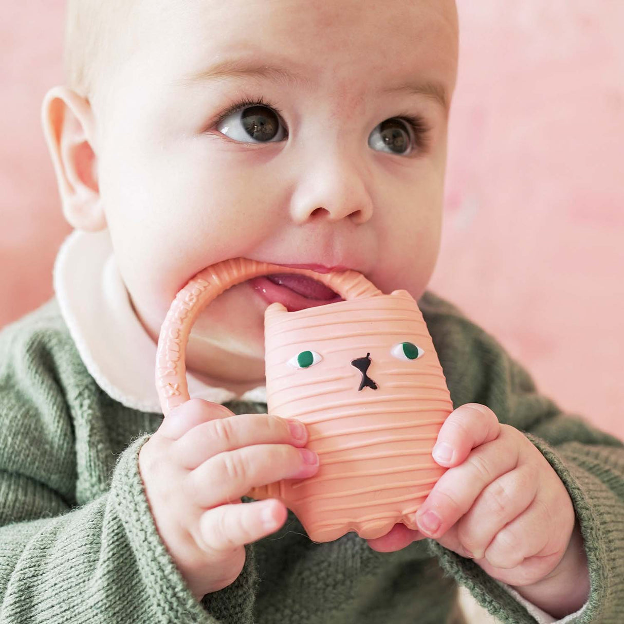 Baby chewing on a soft textured Natural Teether | Ginge Cat made from 100% natural rubber, safe and non-toxic.