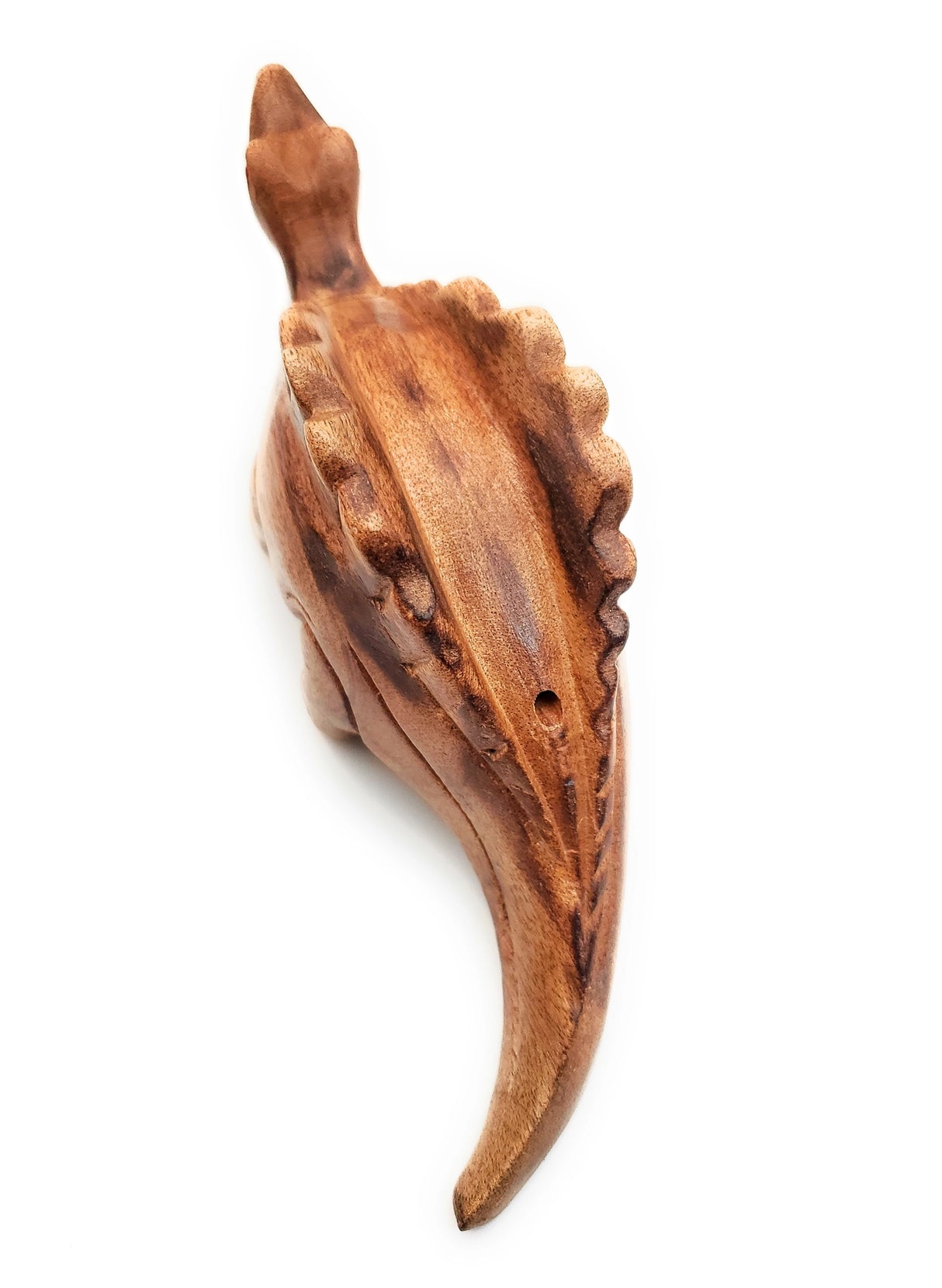Wooden Dino-Sound Stegosaurus hand carved from wood with sound hole on back for blowing to create dinosaur sounds