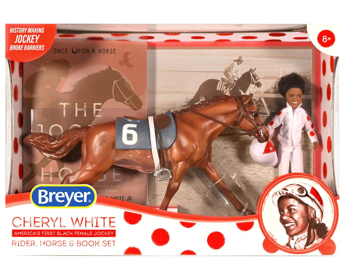 Cheryl White & Jetolara Breyer set with jockey figure, chestnut horse, race saddle, and book in display box.