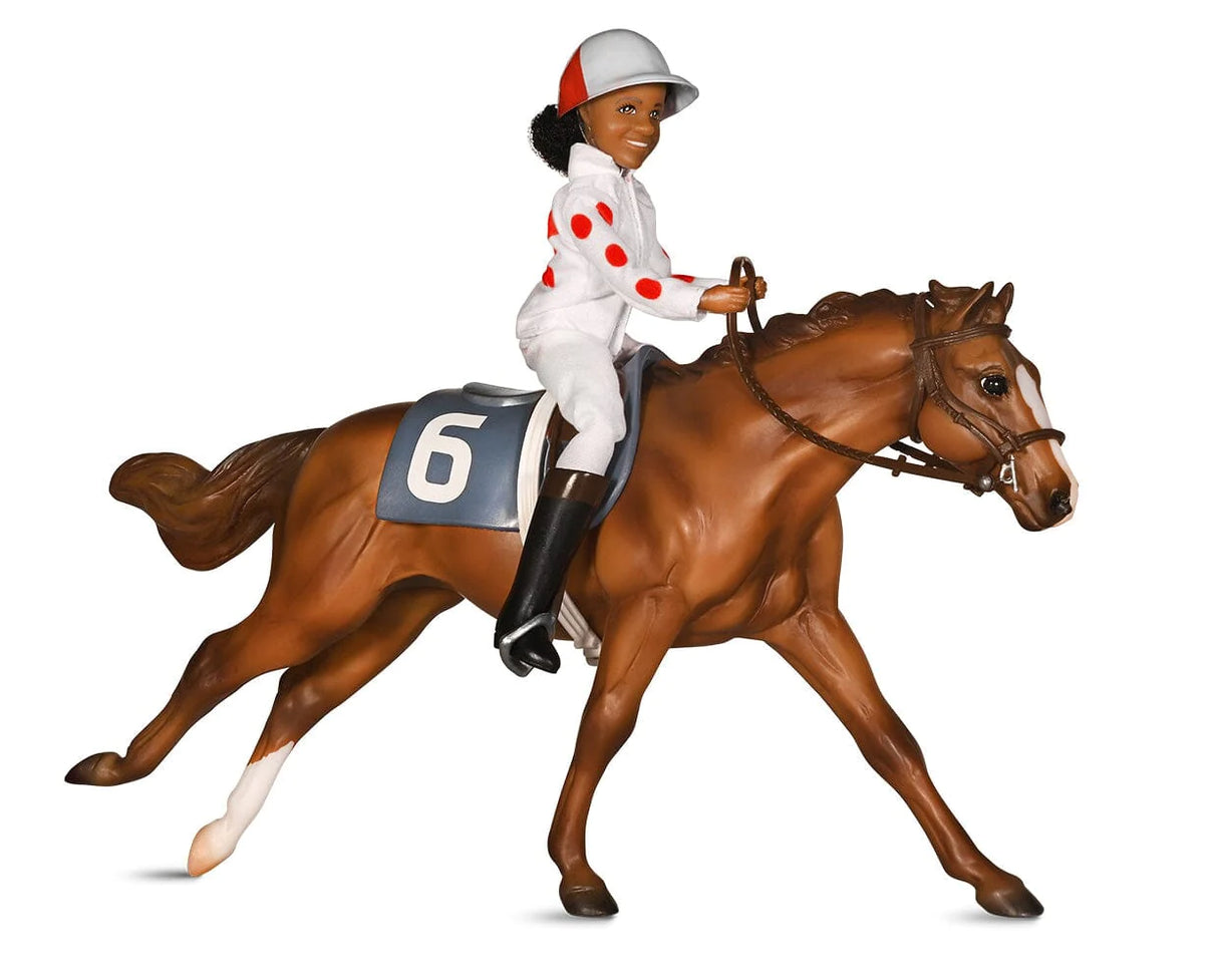 Cheryl White & Jetolara Breyer model set featuring jockey figure and chestnut Thoroughbred horse with race saddle and bridle.