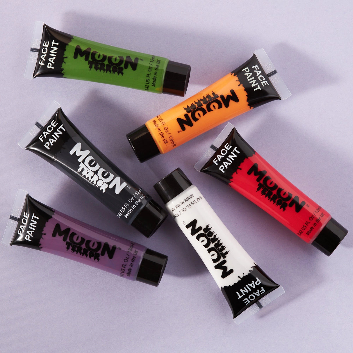 Face & Body Paints | Halloween set of six water based, long lasting, vegan face paint tubes in spooky colors on a light background.
