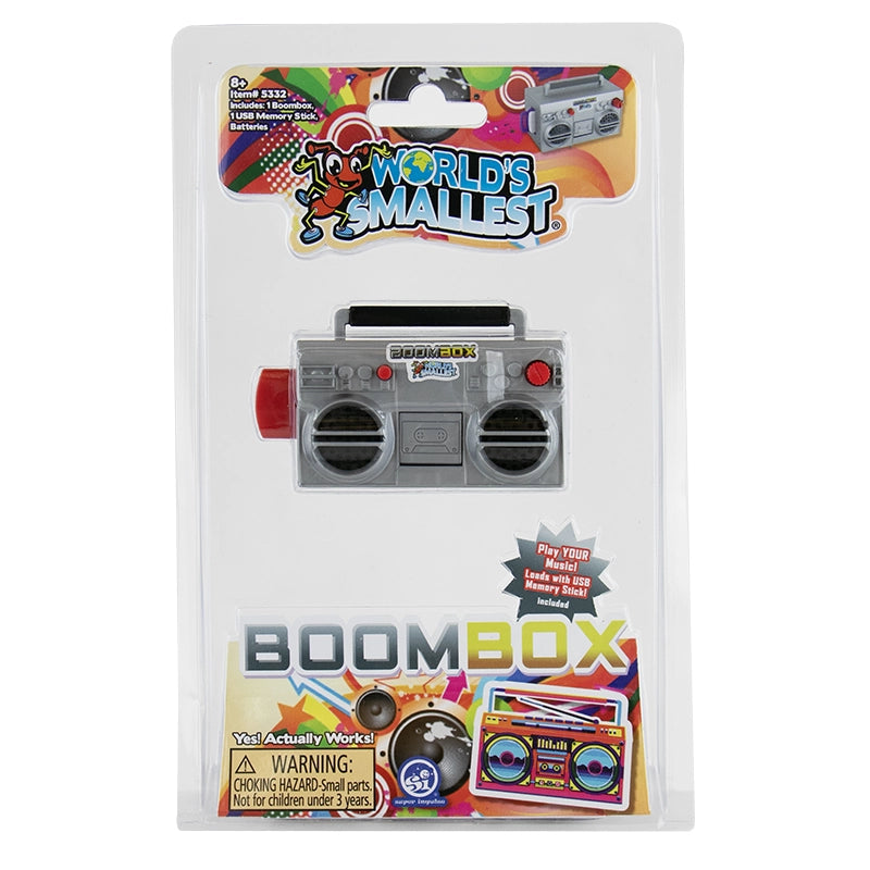 Miniature gray boombox toy with black speakers and red knobs packaged in clear blister pack with colorful label design