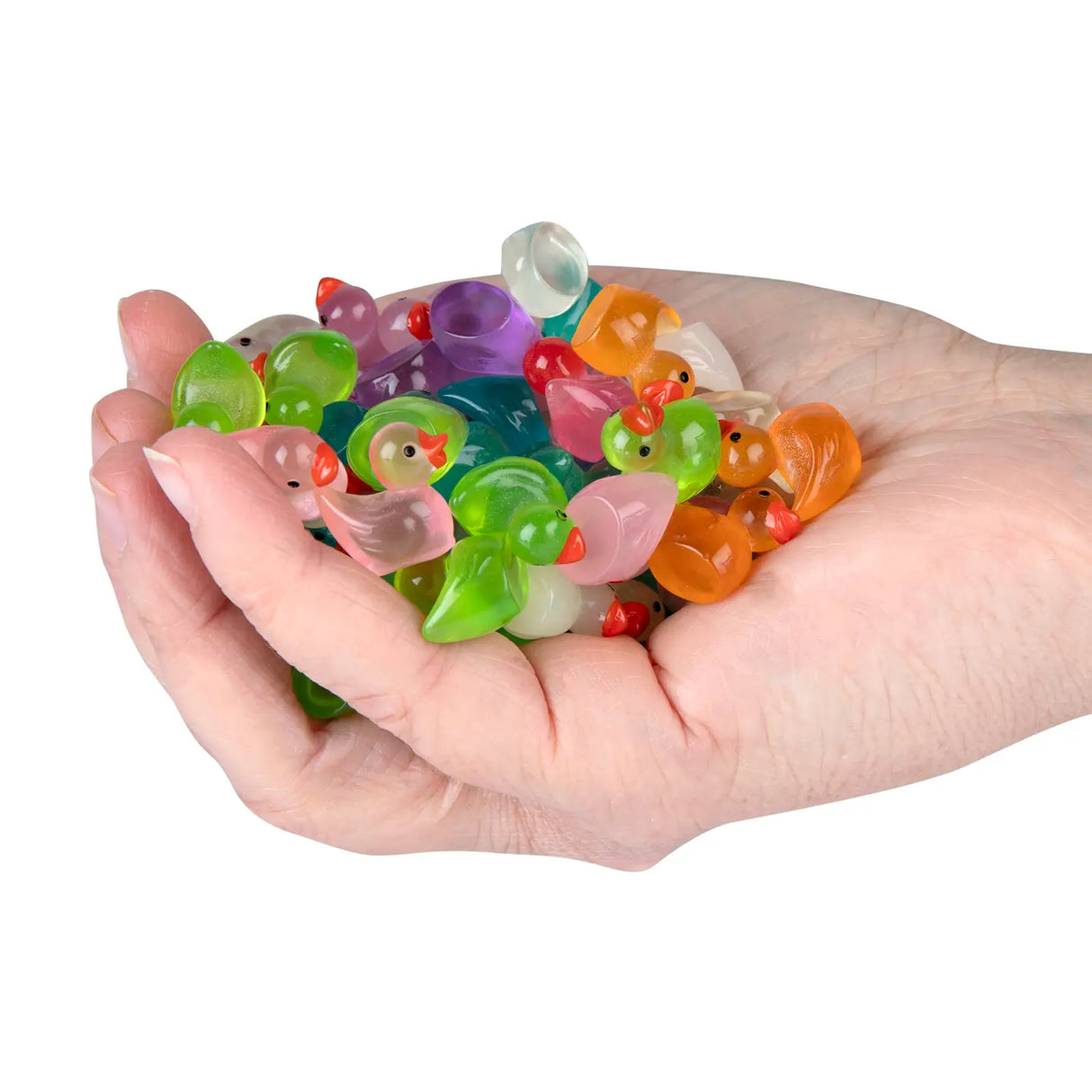 A hand holding a colorful collection of tiny resin ducks from the Teeny Tiny Ducks set.