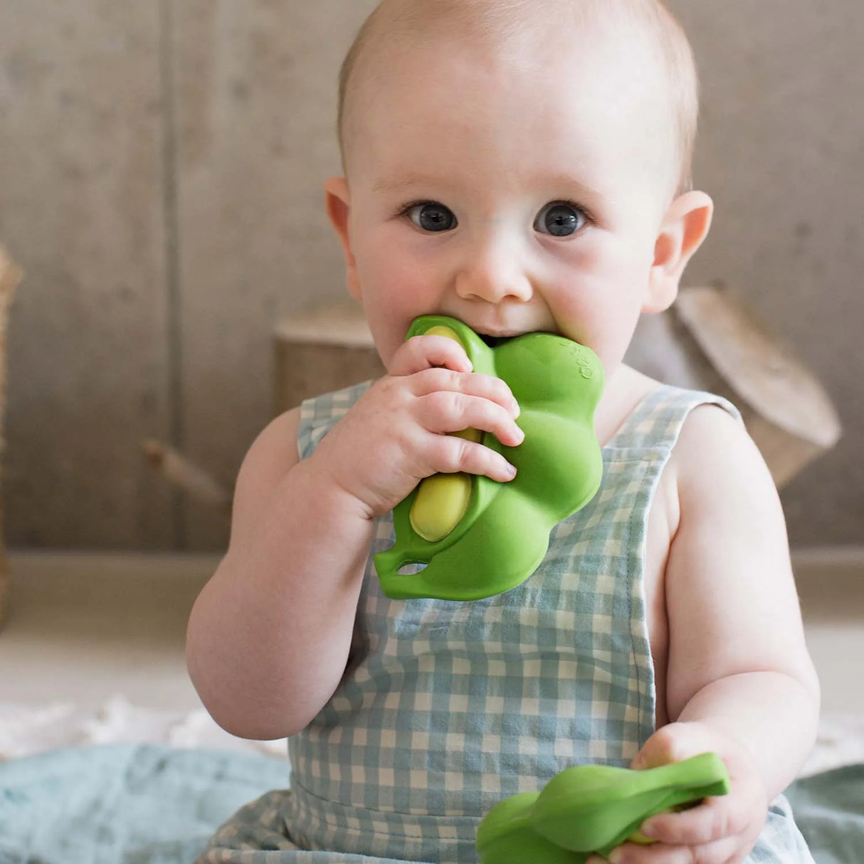 Baby chewing and playing with Natural Teether | Keiko the Edamame, a 100% natural rubber teething toy.
