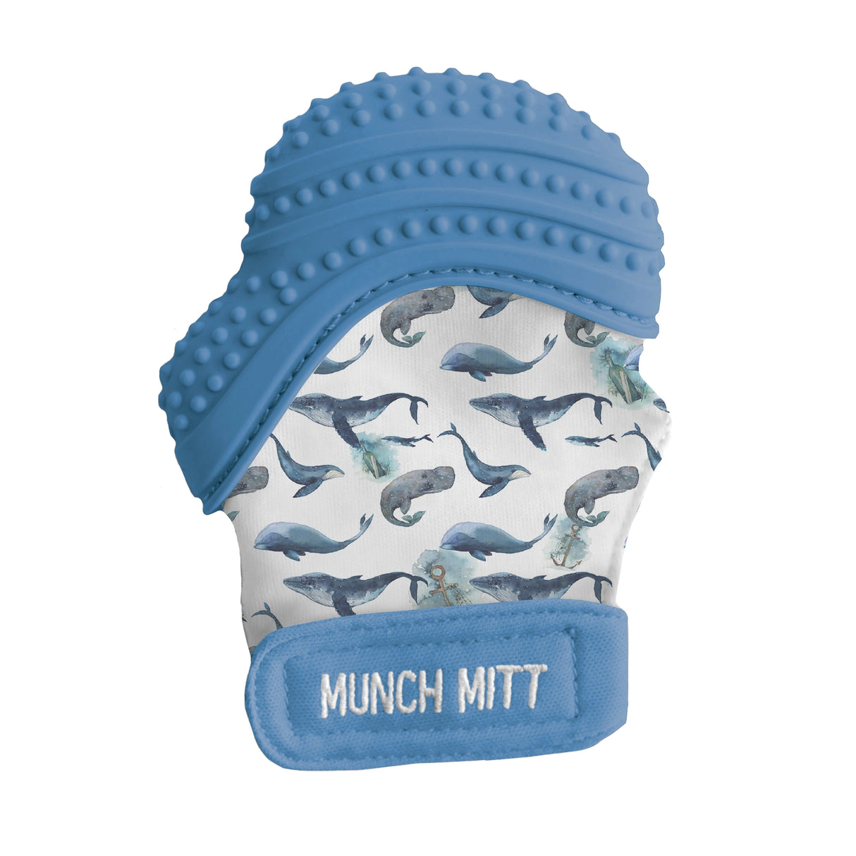 Baby teething mitt with textured blue silicone and whale pattern fabric for soothing and playful chewing.