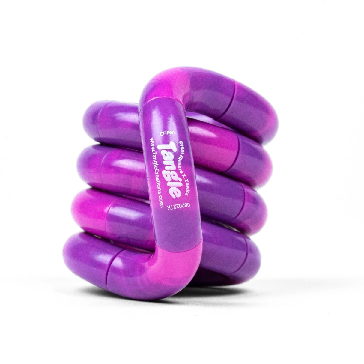 Colorful purple and pink handcrafted Tangle Jr Marble fidget toy designed to enhance creativity and focus