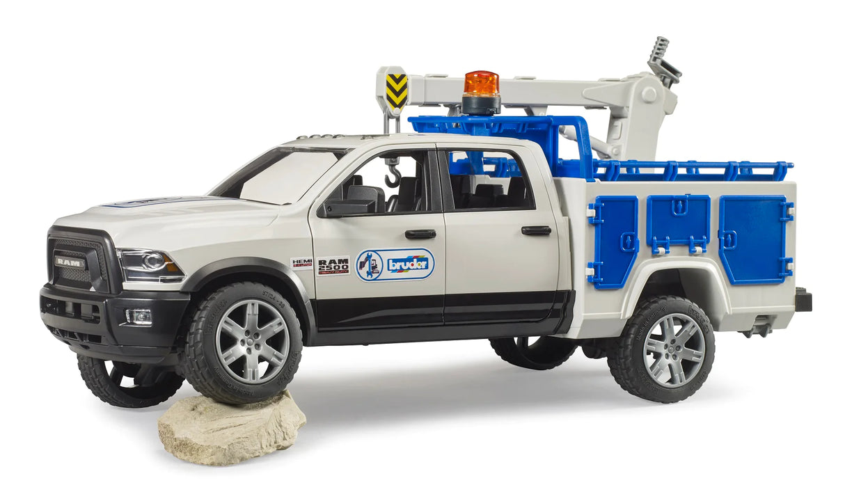 RAM 2500 Service Truck model in white and blue with assembly crane and storage compartments, designed for repair work.