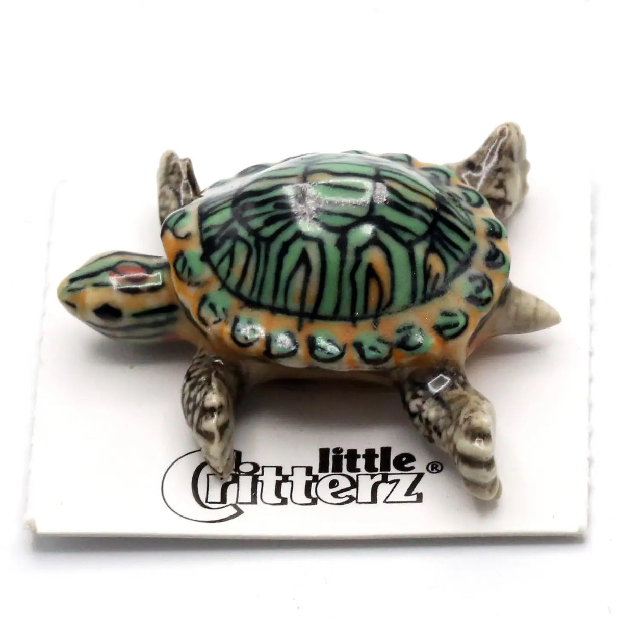 Critterz Bask Red-Eared Slider Turtle miniature porcelain figurine with detailed green and orange shell design.