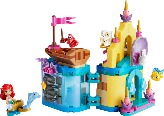 Ariel mini palace toy with boat, sea creatures, shell grotto, and colorful castle towers on white background