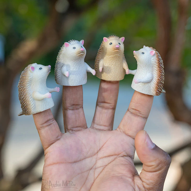 Finger Hedgehog finger puppets in assorted colors on fingers, soft vinyl, adorable miniature hedgehog toys.