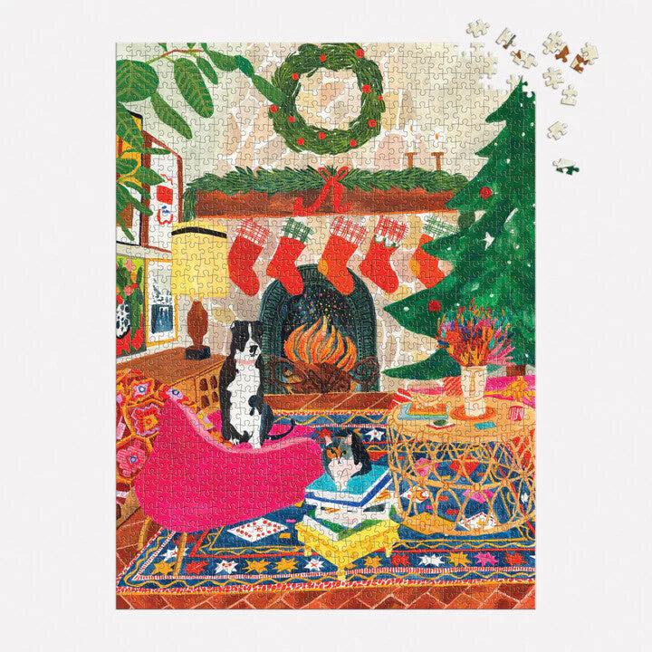 1000pc Fireside Friends Puzzle showing cozy Christmas living room with stockings, wreath, fireplace, cats, and decorated tree.