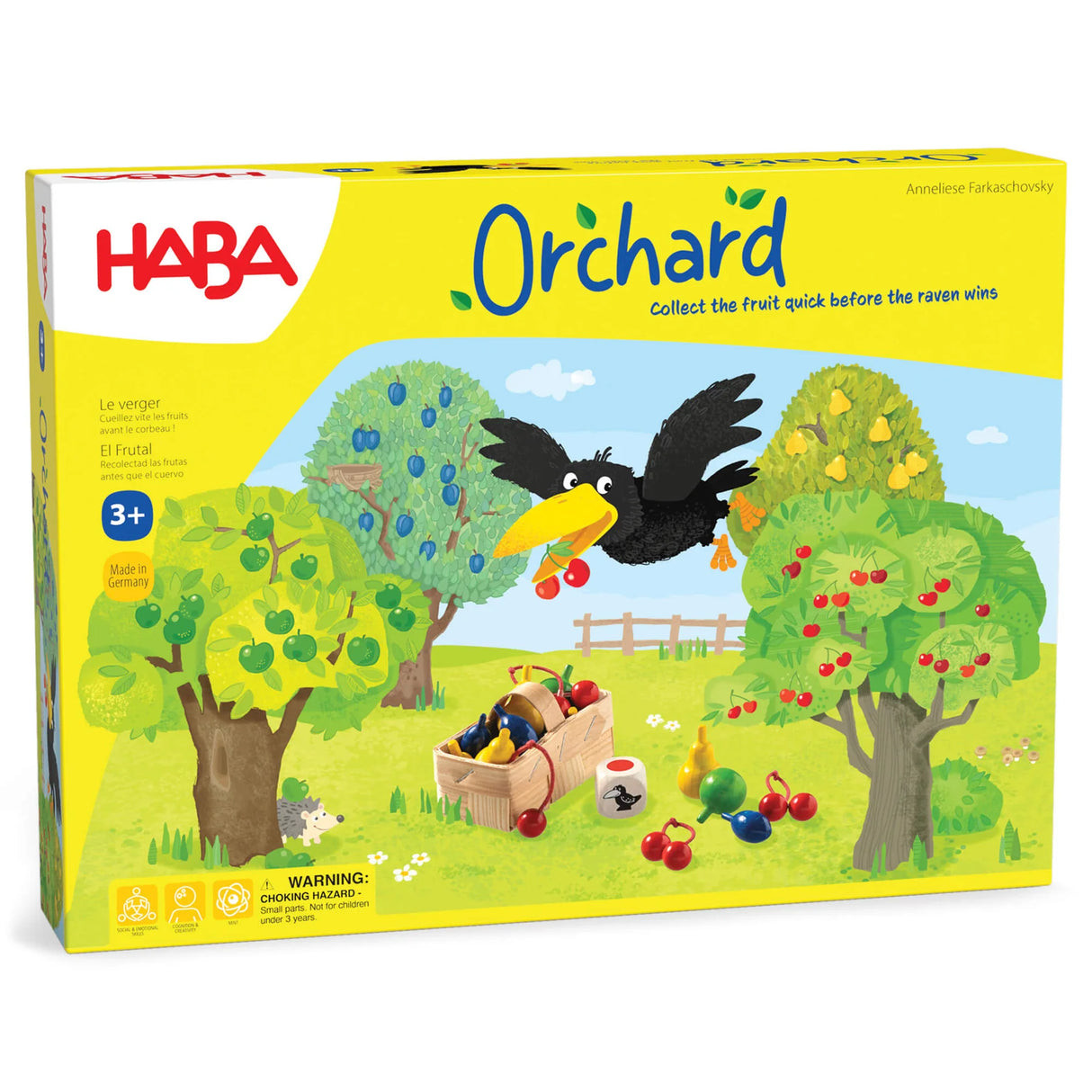 Brightly colored Orchard board game box with trees, fruit, a raven, and a basket on grassy field background