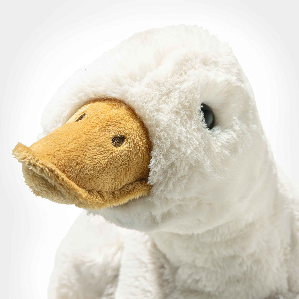 Close-up of the soft plush beak and face of the Goose Gilda Large stuffed animal for cuddling.