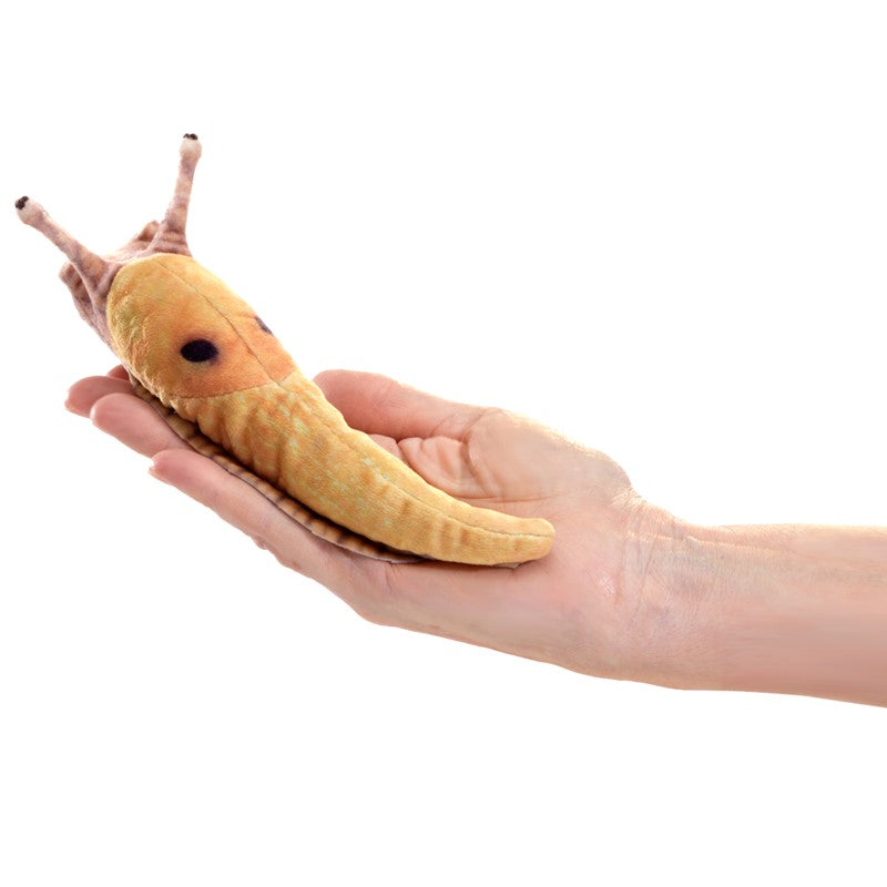 Hand holding a lifelike mini Banana Slug Finger Puppet with detailed texture and weighted beads for tactile play.