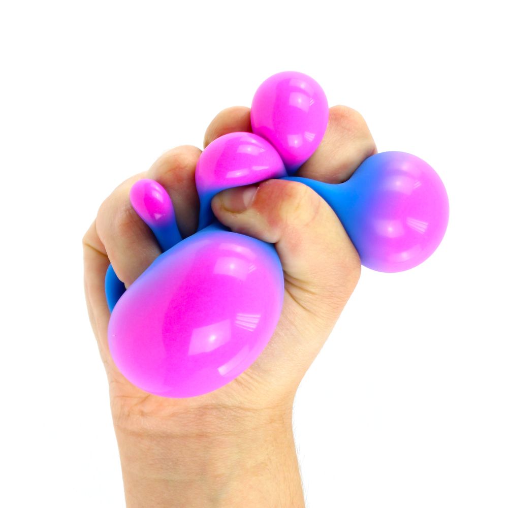 Color Change Super Squidgy Ball held in a hand with bright pink and blue colors