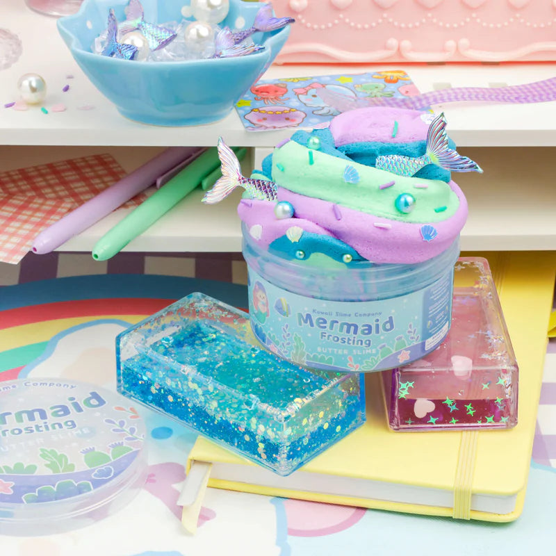 Mermaid Frosting Butter Slime in pastel colors with key lime scent and mermaid tail toppings in a clear jar.