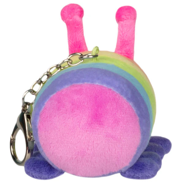 Plush keychain showing the back of a rainbow-striped caterpillar with pink antennae and purple feet