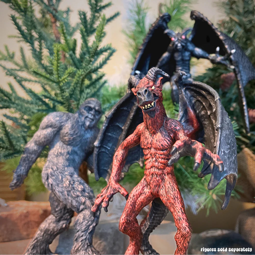 Jersey Devil figure with bat wings, horned goat-like head, and cloven hooves among forest background.