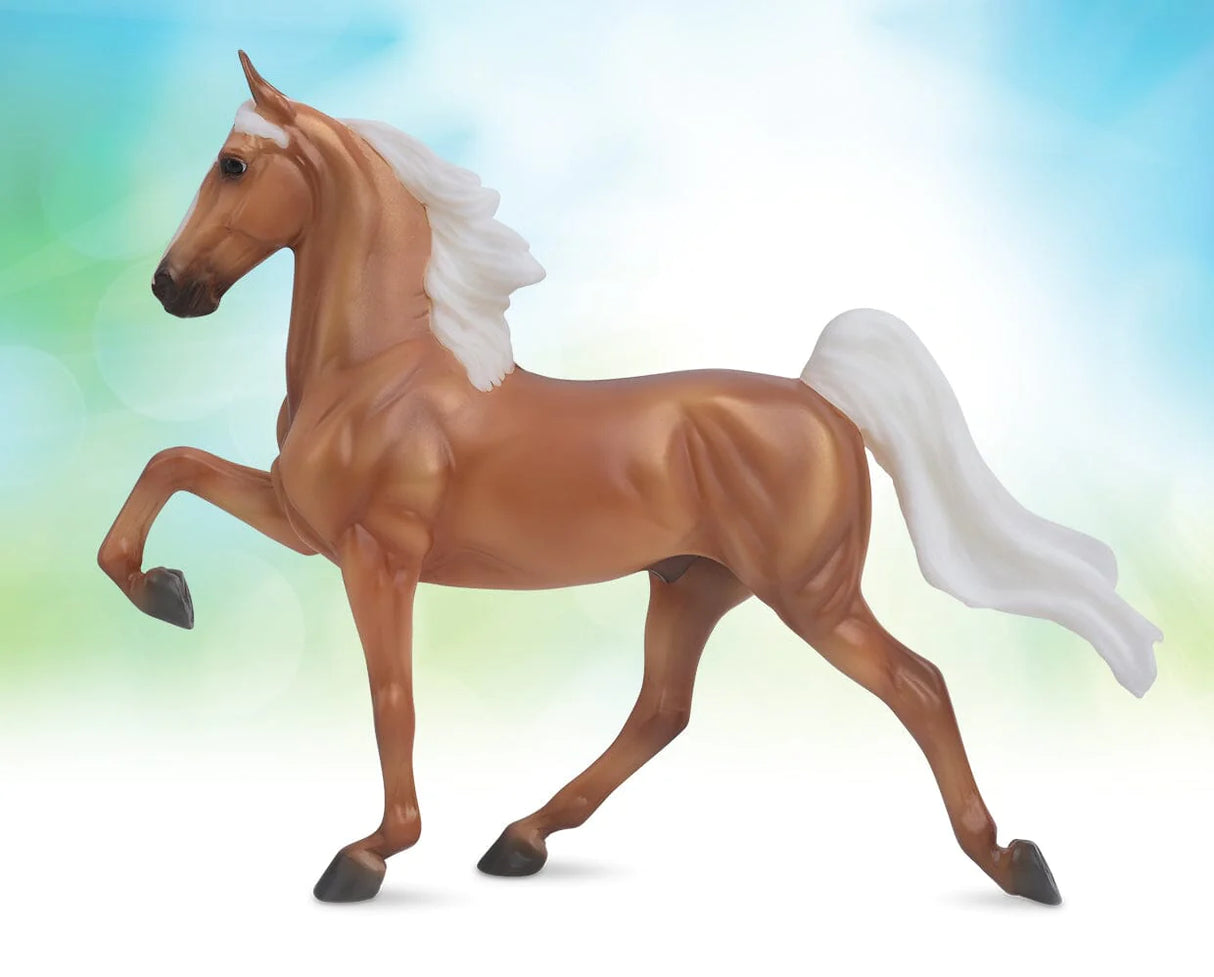 Palomino Saddlebred model horse with elegant high-stepping pose and flowing white mane and tail in 1:12 scale.