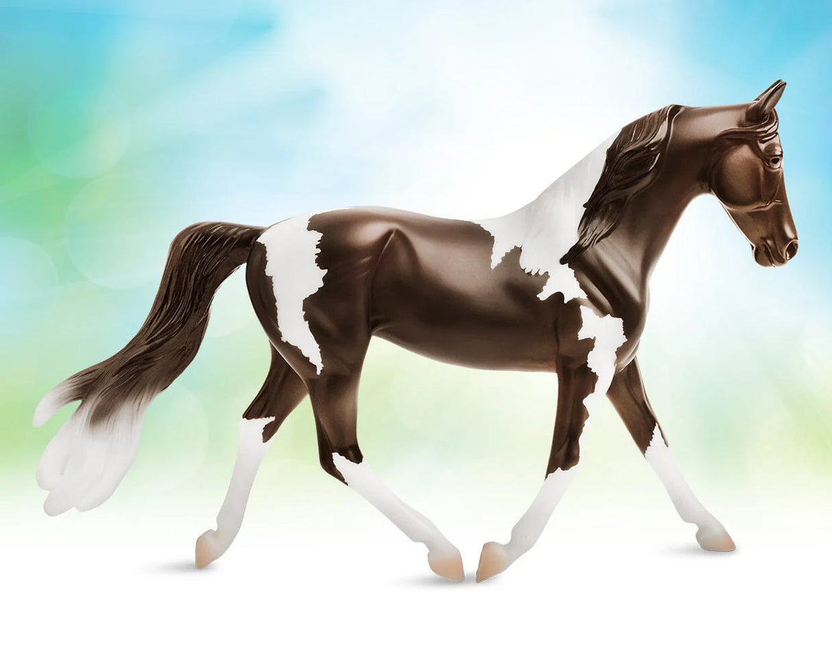 Pinto model horse with brown and white patches, realistic details, from the Freedom Series, 1:12 scale.